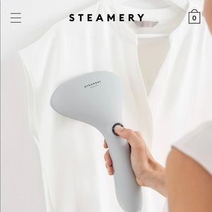 Steamer to remove wrinkles in fabric, travel friendly, new unopened.